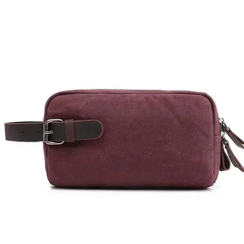 Private label travel accessories manufacturer showing custom logo branding on a gray hanging toiletry bag